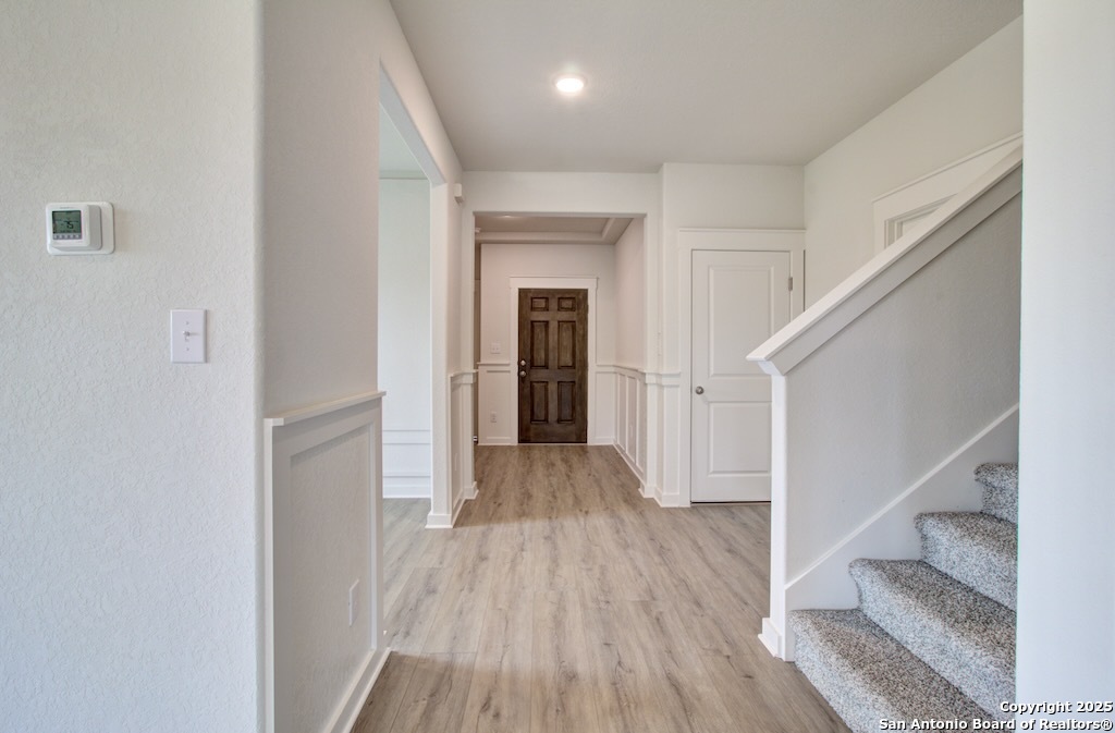 3625 Meteor Road New Braunfels, TX 78130 - Photo 8 of 39 a view of a hallway with wooden floor and entryway