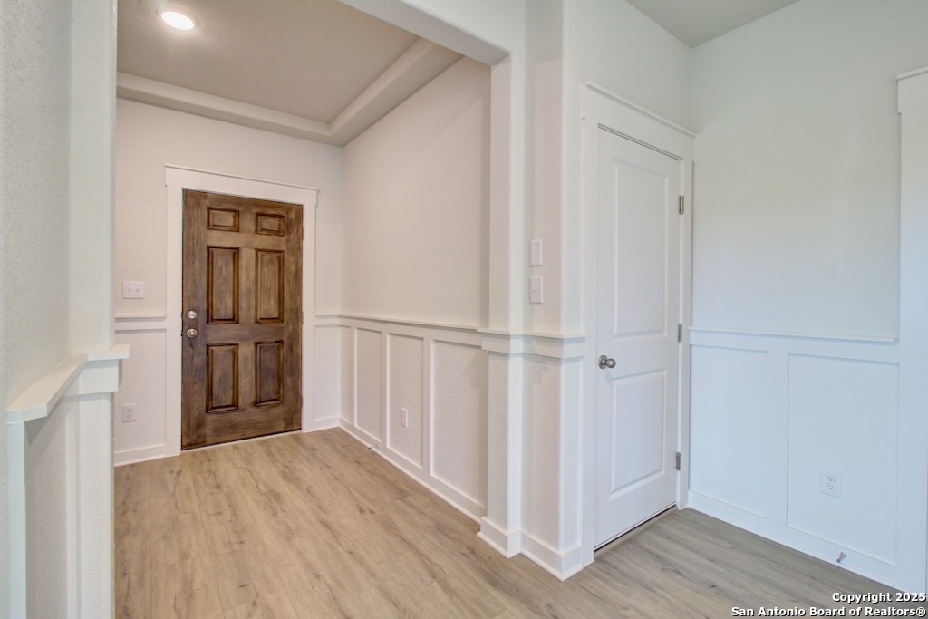 3625 Meteor Road New Braunfels, TX 78130 - Photo 9 of 39 a view of a hallway with wooden floor and entryway