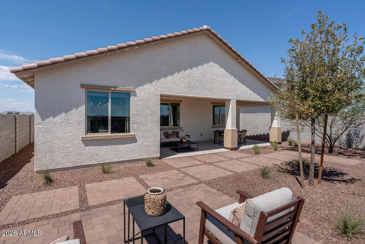 17547 West Fulton Street Goodyear, AZ 85338 - Photo 9 of 10 a view of a house with backyard and sitting area
