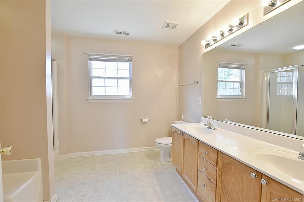 1021 Kilpatrick Lane Fort Mill, SC 29708 - Photo 23 of 34 a spacious bathroom with a double vanity sink toilet and a tub