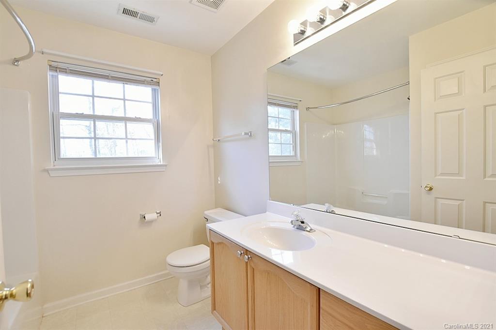 1021 Kilpatrick Lane Fort Mill, SC 29708 - Photo 27 of 34 a bathroom with a sink a toilet and a window
