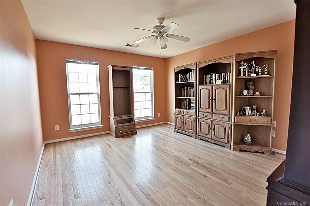 1021 Kilpatrick Lane Fort Mill, SC 29708 - Photo 29 of 34 an empty room with wooden floor closet and windows