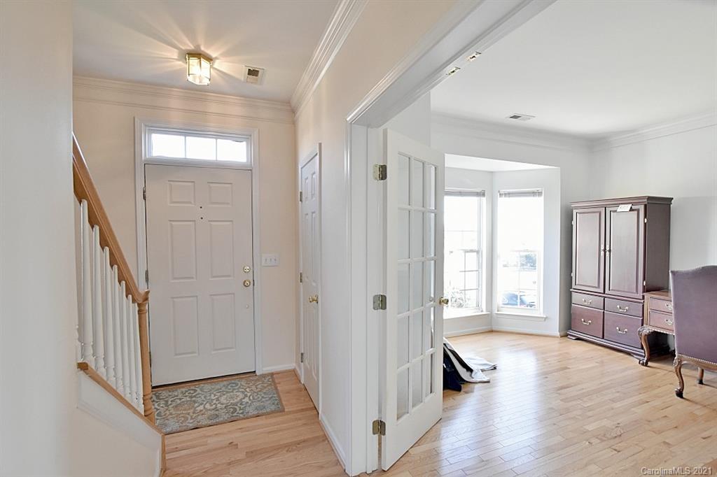 1021 Kilpatrick Lane Fort Mill, SC 29708 - Photo 4 of 34 a view of an entryway with wooden floor and livingroom view