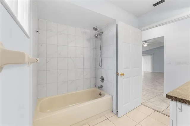 a view of a swimming pool with a patio