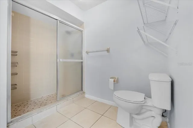 a view of a backyard with wooden fence