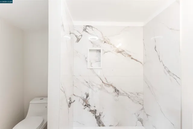 a bathroom with a bathtub and shower