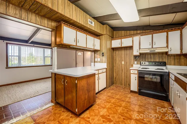 a kitchen with stainless steel appliances granite countertop a stove a refrigerator and a stove