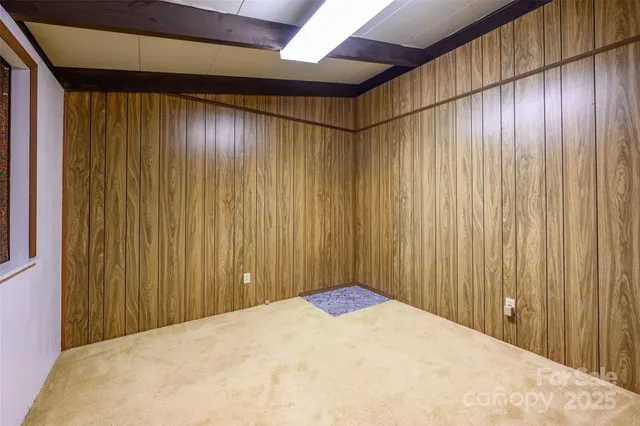 a view of a big room with wooden walls