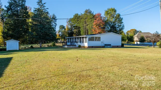 a view of a swimming pool with an outdoor space and seating area