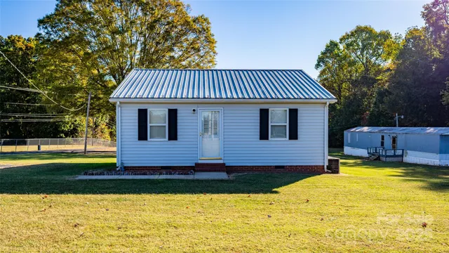 a view of a house with swimming pool