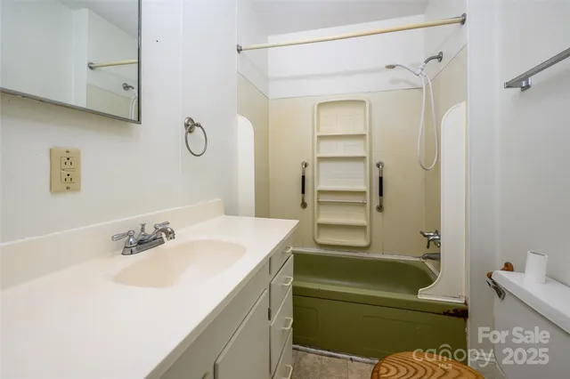 a bathroom with a sink a toilet and a bathtub