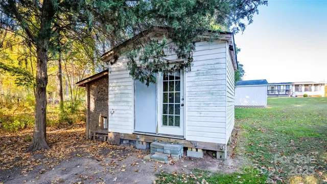 a small hut under the tree