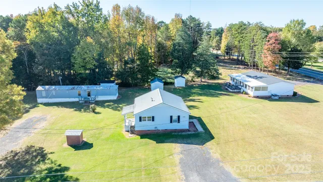 a swimming pool with some trees in the background