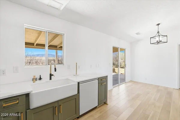 a bathroom with a sink and a window