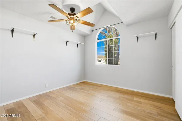 a view of an empty room with a window