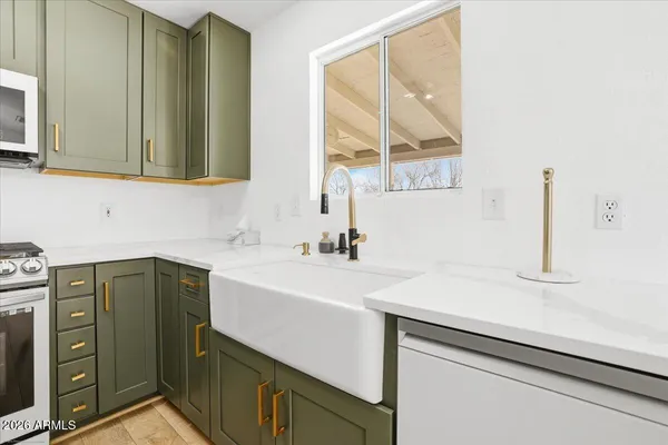 a kitchen with a sink and a window