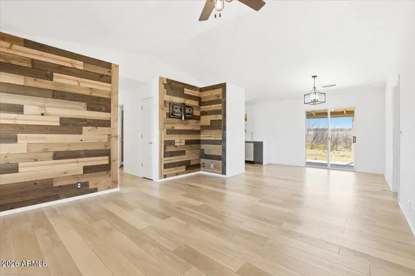 a view of room with cabinet and windows