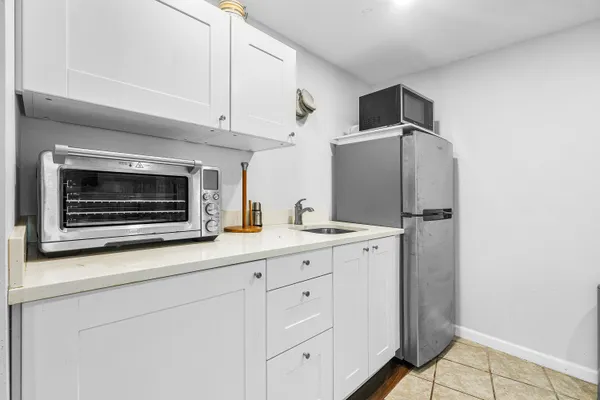 a kitchen with appliances and cabinets
