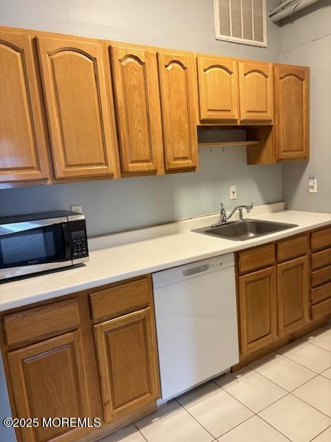 27-29 East Front Street, Unit B Red Bank, NJ 07701 - Photo 5 of 7 a kitchen with stainless steel appliances granite countertop a sink and cabinets