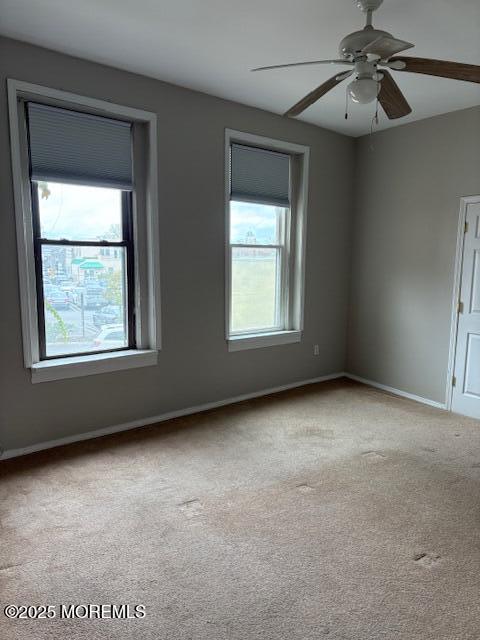 27-29 East Front Street, Unit B Red Bank, NJ 07701 - Photo 6 of 7 an empty room with windows and fan