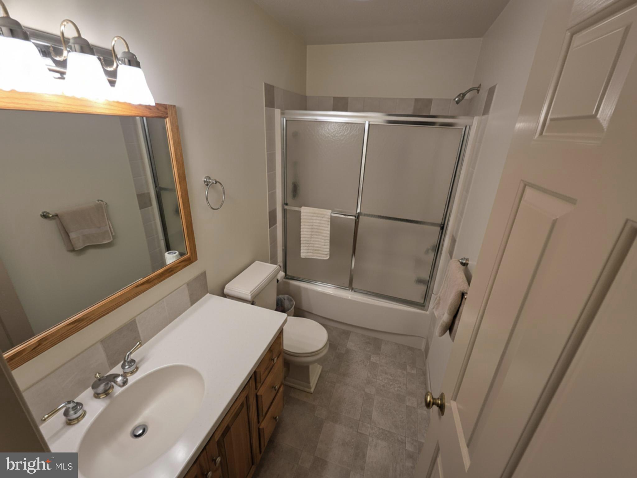 588 Crosswinds Drive Lititz, PA 17543 - Photo 17 of 38 a bathroom with a sink and mirror with toilet