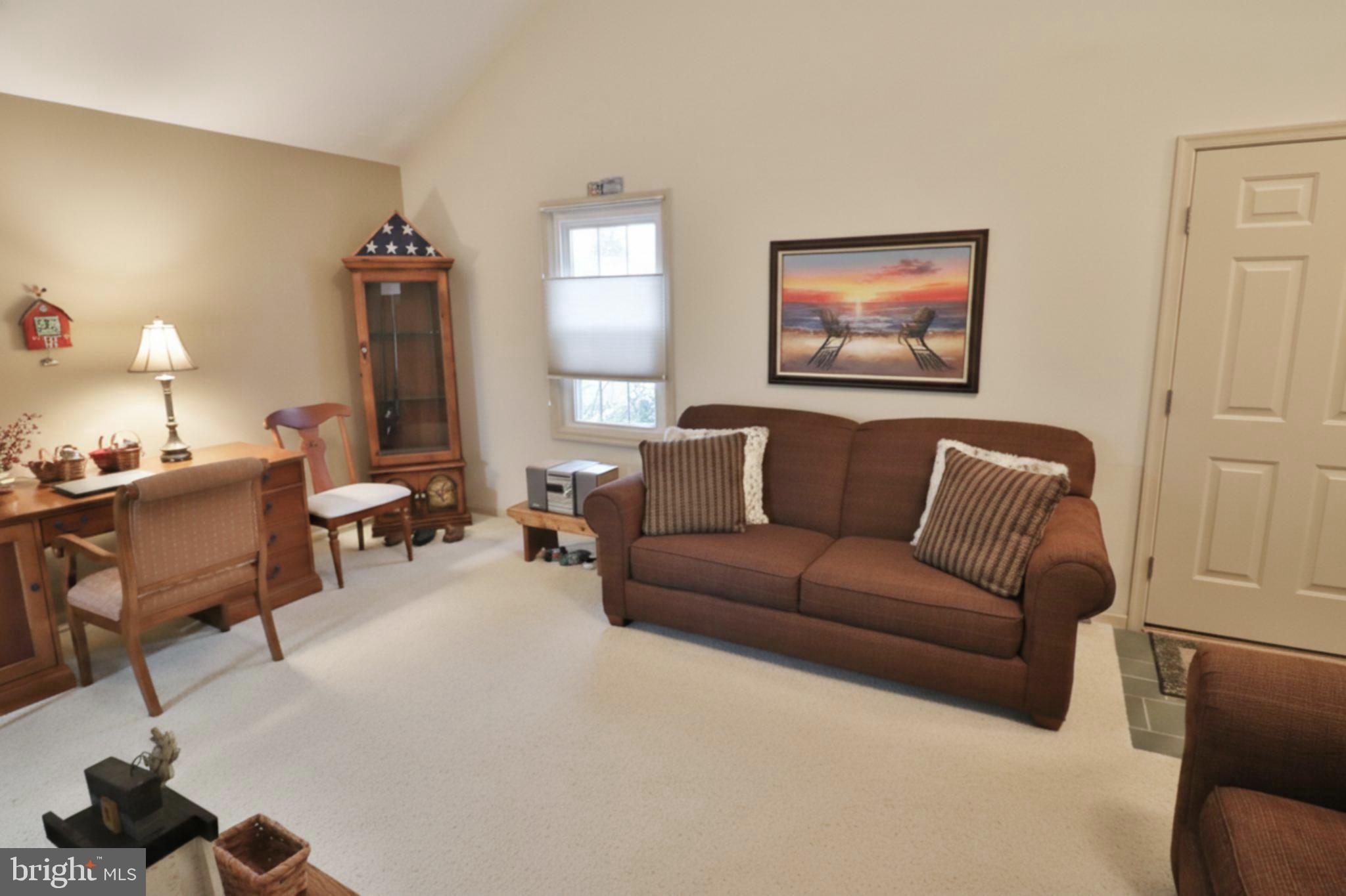 588 Crosswinds Drive Lititz, PA 17543 - Photo 25 of 38 a living room with furniture a lamp and a window
