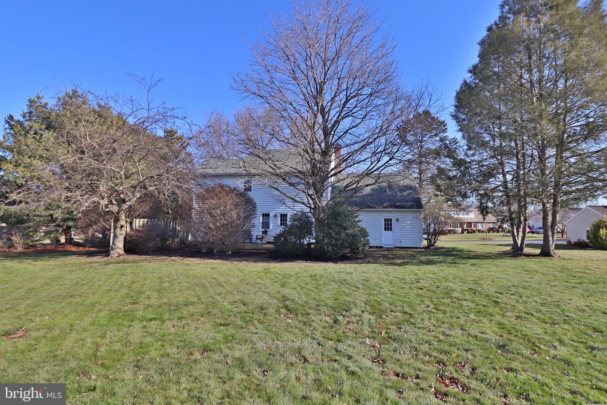588 Crosswinds Drive Lititz, PA 17543 - Photo 4 of 38 a yellow house sitting in middle of a field