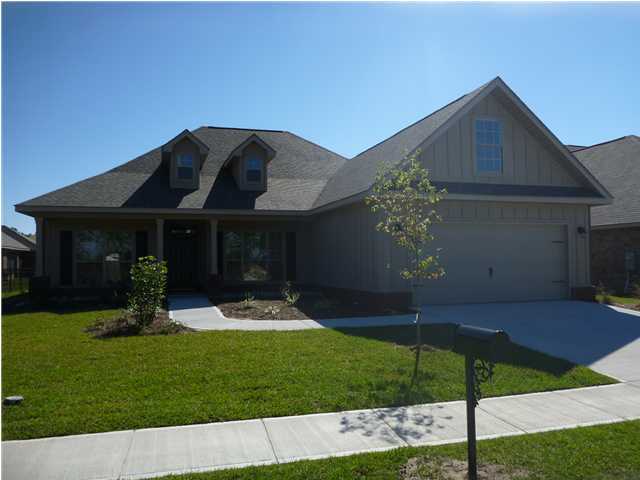 343 Whispering Lake Drive Santa Rosa Beach, FL 32459 - Photo 1 of 22 a front view of a house with garden