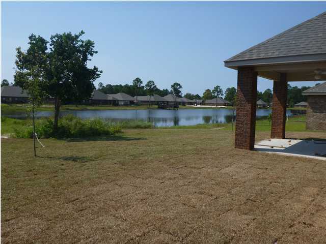 343 Whispering Lake Drive Santa Rosa Beach, FL 32459 - Photo 12 of 22 a view of a house with a yard
