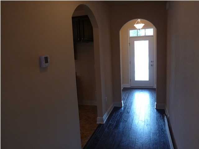 343 Whispering Lake Drive Santa Rosa Beach, FL 32459 - Photo 17 of 22 an empty room with wooden floor and windows