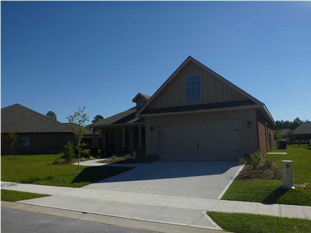 343 Whispering Lake Drive Santa Rosa Beach, FL 32459 - Photo 2 of 22 a front view of a house with a yard