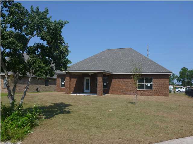 343 Whispering Lake Drive Santa Rosa Beach, FL 32459 - Photo 21 of 22 a house with trees in the background