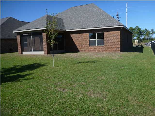 343 Whispering Lake Drive Santa Rosa Beach, FL 32459 - Photo 4 of 22 a house that has a backyard