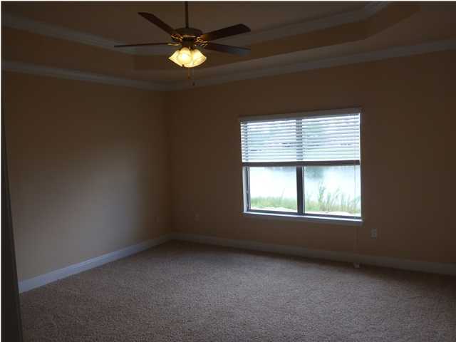 343 Whispering Lake Drive Santa Rosa Beach, FL 32459 - Photo 5 of 22 an empty room with a window