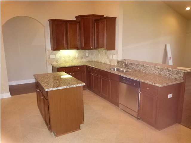 343 Whispering Lake Drive Santa Rosa Beach, FL 32459 - Photo 9 of 22 a kitchen with a sink and cabinets
