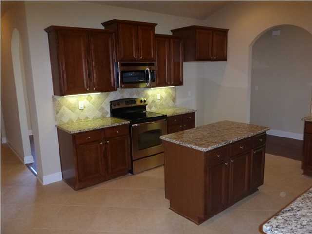 343 Whispering Lake Drive Santa Rosa Beach, FL 32459 - Photo 10 of 22 a kitchen with a stove and a microwave