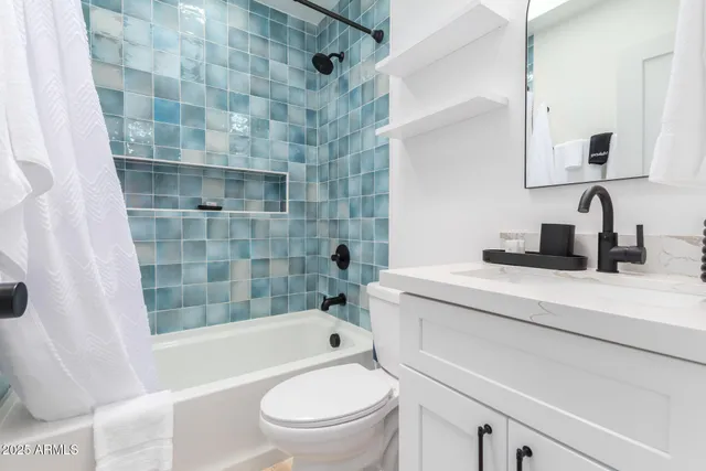 a bathroom with a sink a toilet and a bathtub