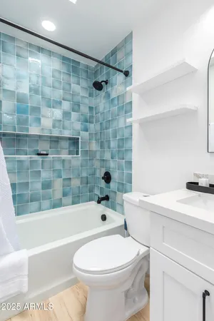 a bathroom with a sink a toilet and a bathtub