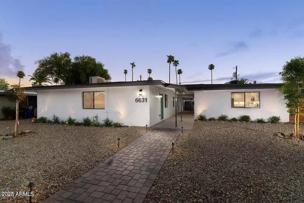 a view of a backyard with a house