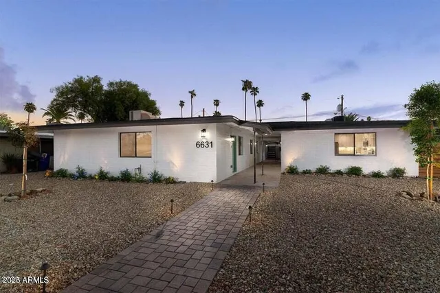 a view of a backyard with a house
