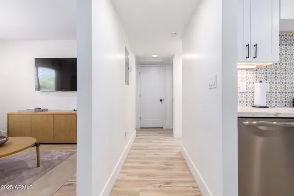 a view of a livingroom with furniture and a flat screen tv