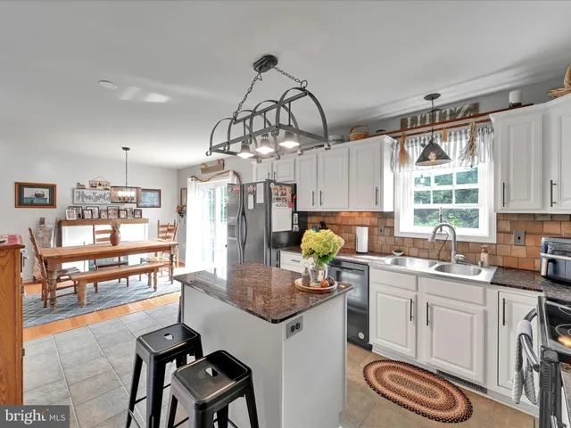 a kitchen with sink cabinets and window