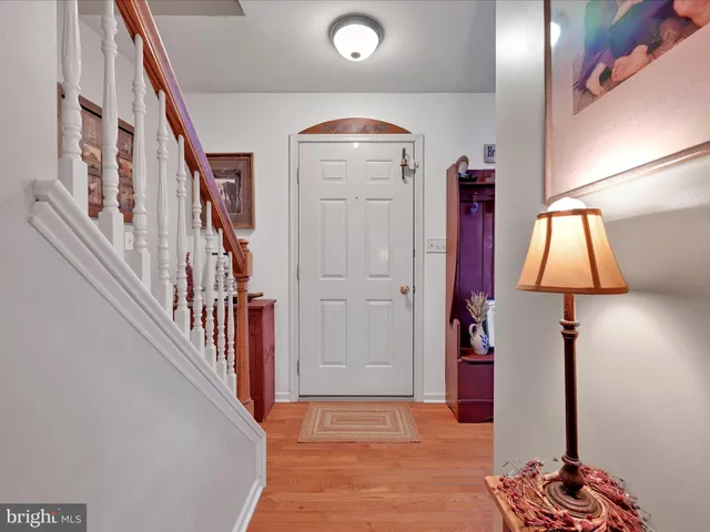 a view of an entryway with wooden floor