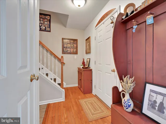 a view of an entryway with wooden floor