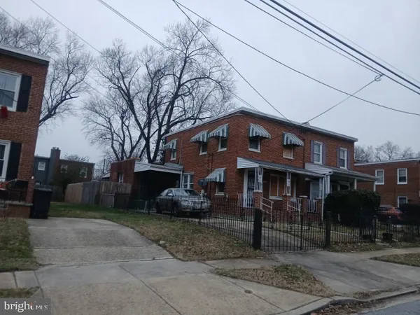a view of a building with a yard