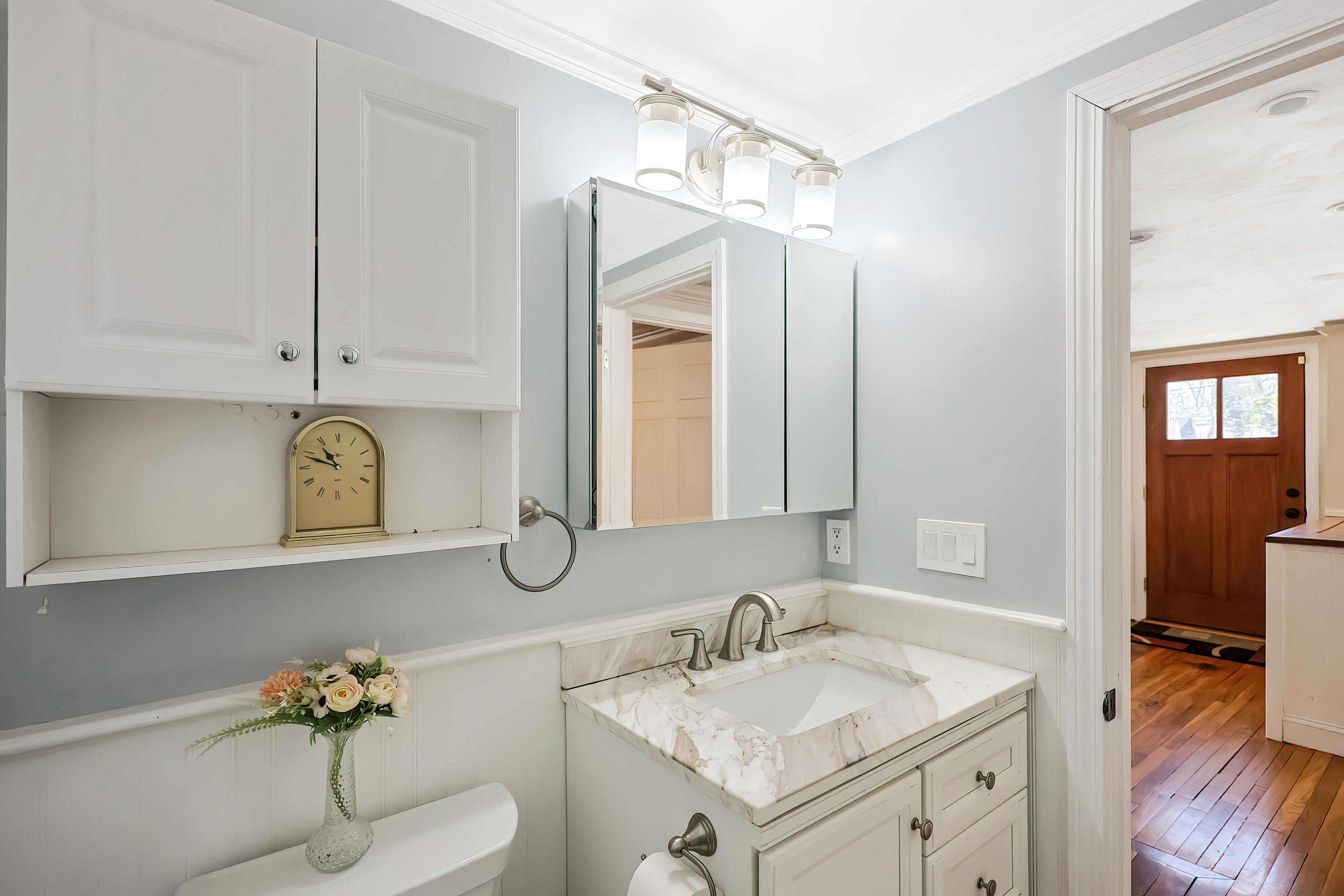 9 Marilyn Road Bourne, MA 02532 - Photo 19 of 54 a bathroom with a toilet sink and mirror