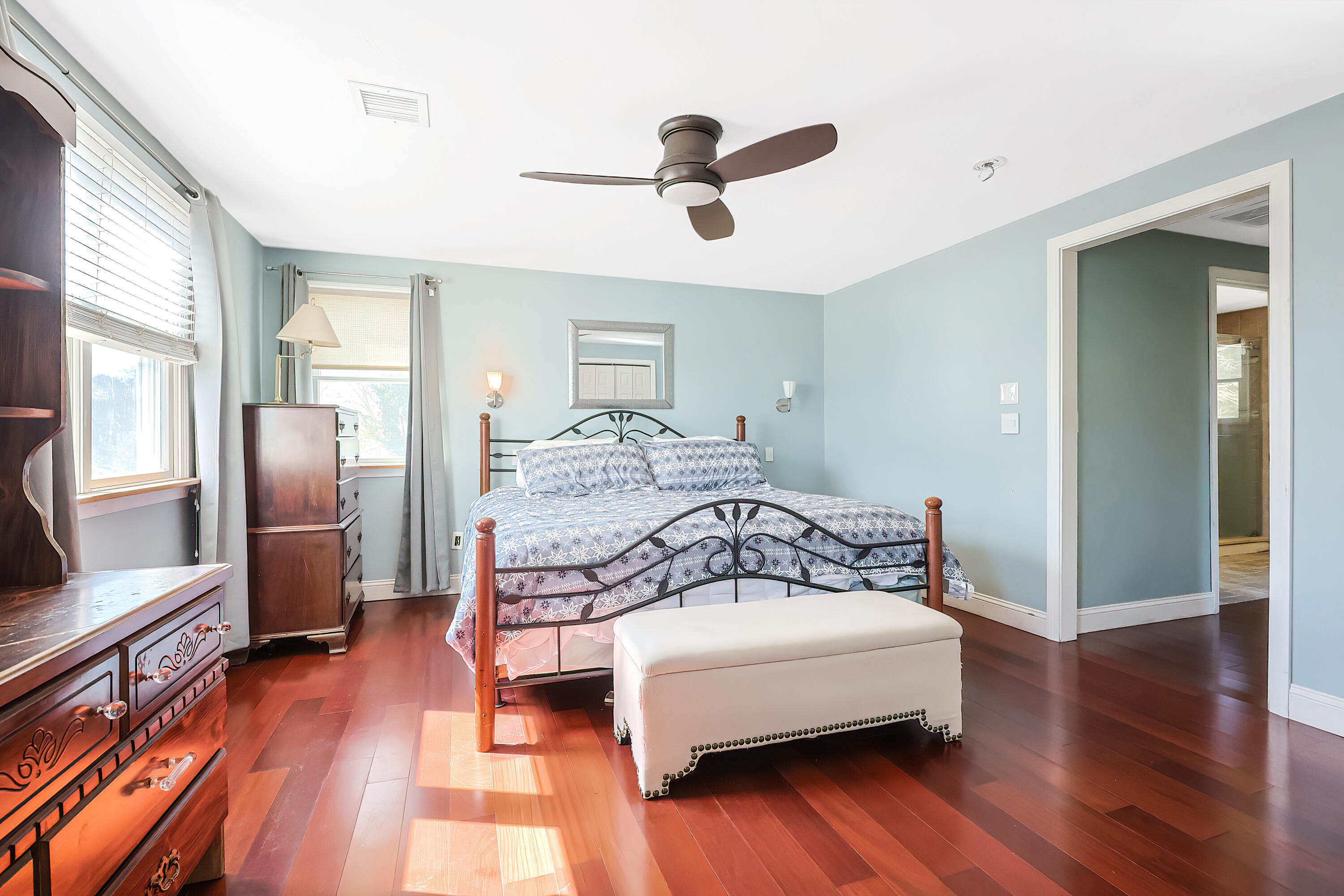 9 Marilyn Road Bourne, MA 02532 - Photo 26 of 54 a bedroom with a bed and wooden floor