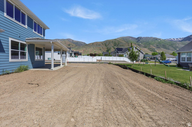 1315 West 3200 South, Unit 17 Perry, UT 84302 - Photo 51 of 58 Expansive backyard space with a covered patio, ready for custom landscaping