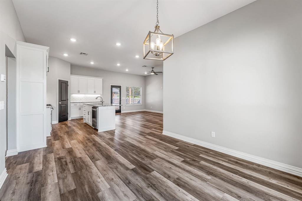 1501 Johnson Road, Unit A Iowa Park, TX 76367 - Photo 14 of 30 a view of kitchen and living room