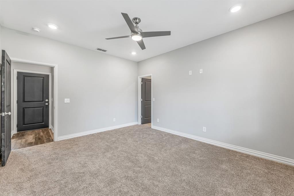 1501 Johnson Road, Unit A Iowa Park, TX 76367 - Photo 17 of 30 an empty room with closet and windows